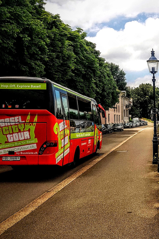 Basel: Sightseeing Bus Tour with Audio Guide - Medieval walls, paper, and the art museum