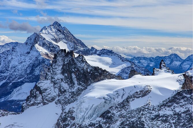 Guided Excursion to Mount Titlis Eternal Snow and Glacier from Lucerne - Crossing the Cliff Walk