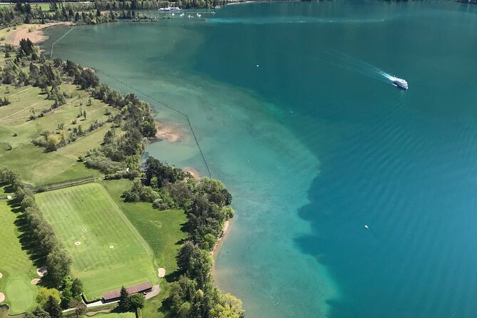 Private Sightseeing Boat Trip on Lake Thun, Interlaken - Pizza with a lake and mountain backdrop