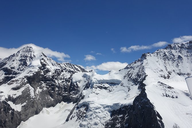 Private Swiss Alps helicopter tour over snow covered mountain peaks and glaciers - What 42 minutes above the Bernese Alps feels like