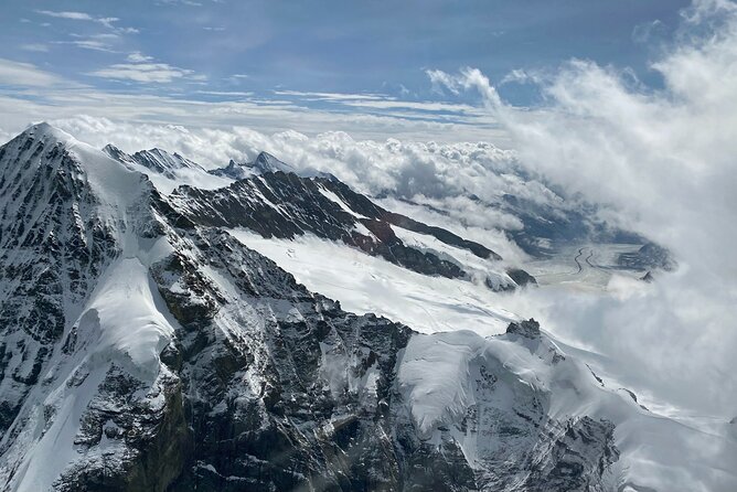 Private Swiss Alps helicopter tour over snow covered mountain peaks and glaciers - Interlaken between Lake Thun and Lake Brienz