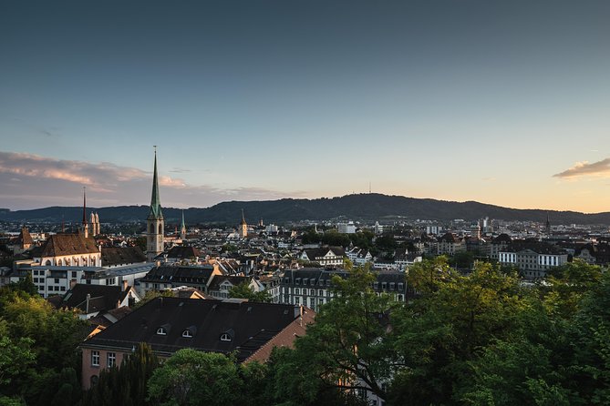 Zurich City Tour with Audio Commentary - Old Town churches and Limmatquai from the window