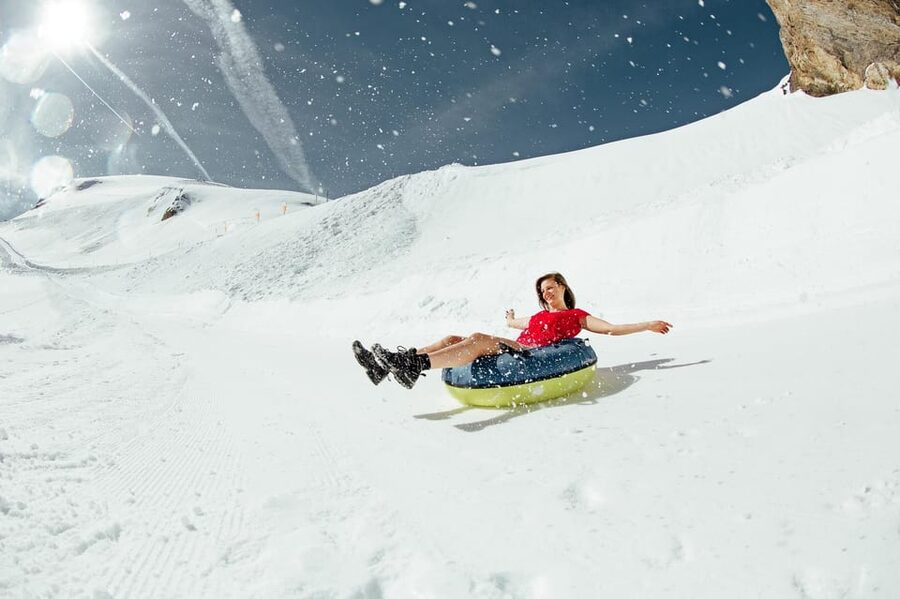 Zurich: Mount Titlis Snowmobile Adventure & Lucern Day Trip - Riding the electric snowmobile at Trübsee