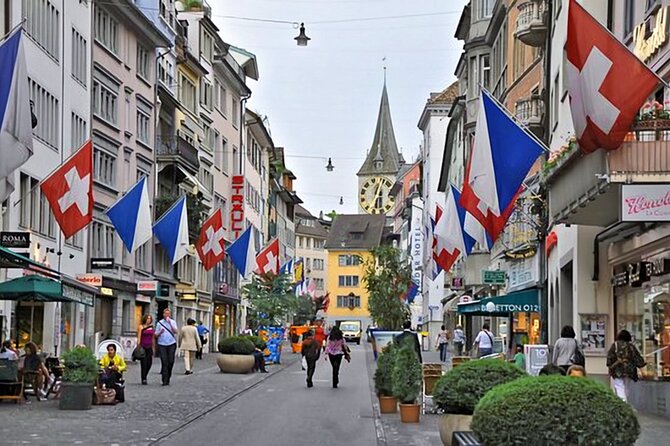 Zurich Small-Group Walking Tour Including a Lake Cruise - Paradeplatz and Bahnhofstrasse show the modern city
